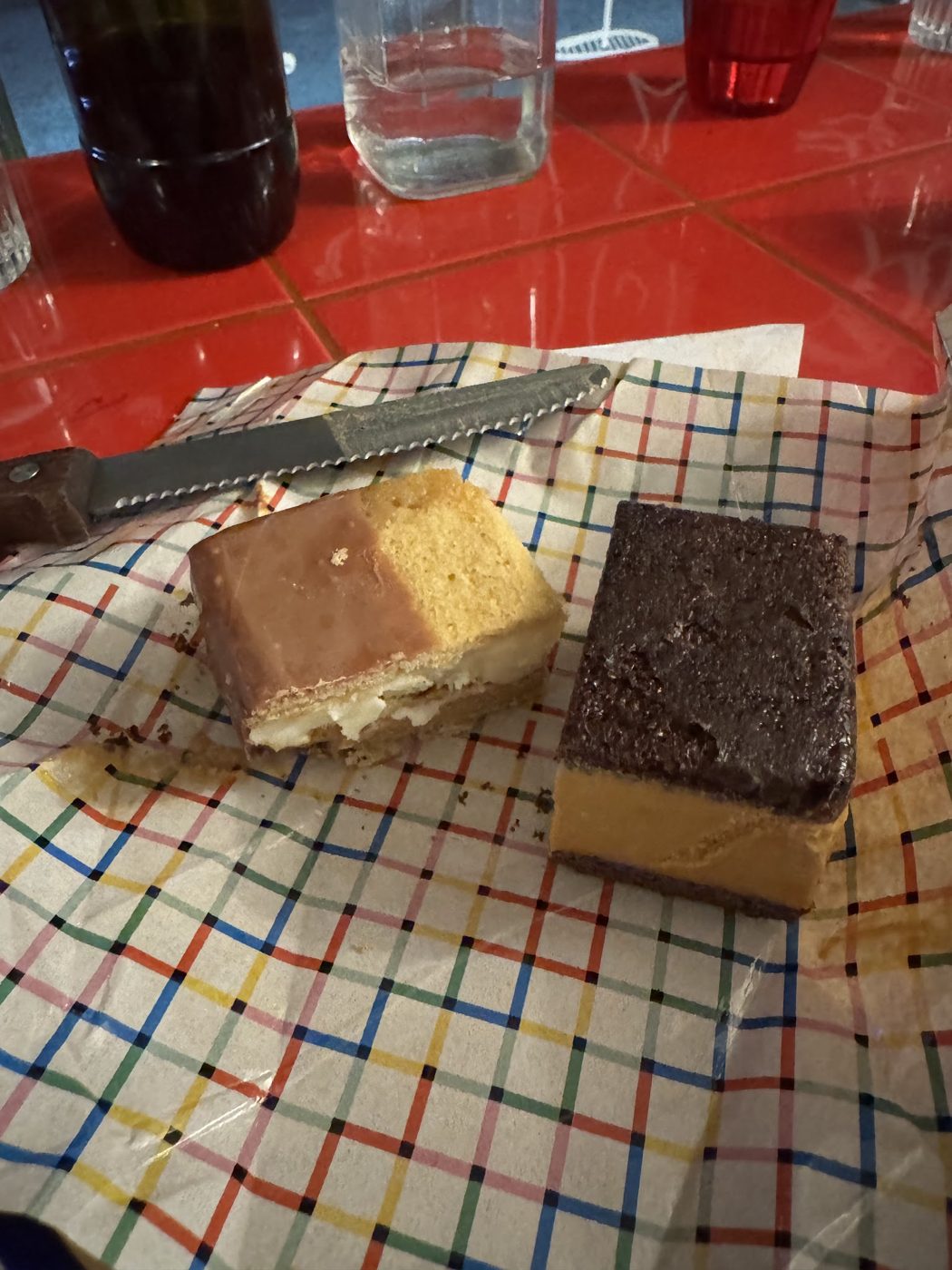Two dessert slices on a chequered cloth